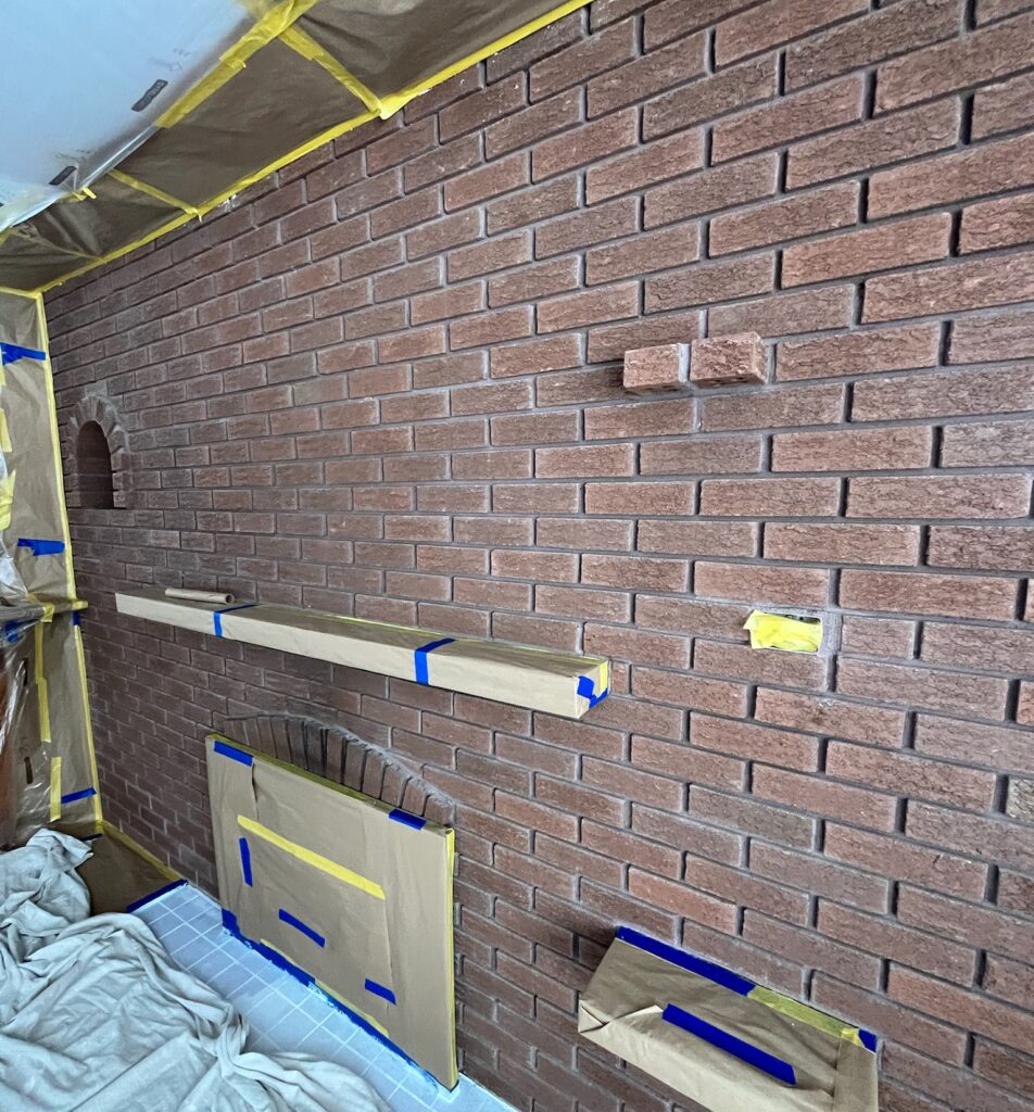 fire place that is being prepped to paint