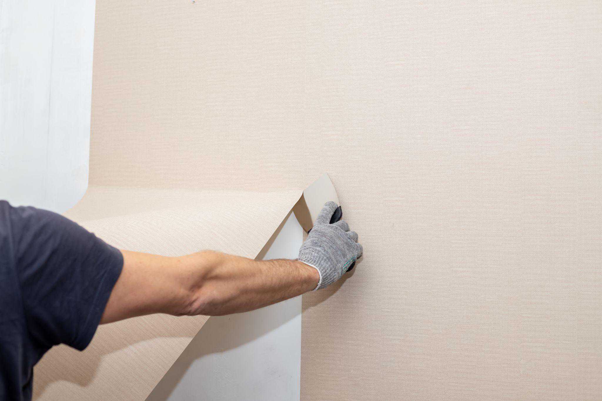 wallpaper being put on a wall